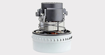 Moteur normalisé pour aspirateur avec rotor, stator et balais visibles